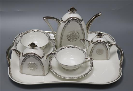 An Art Deco silver and white decorated tea for two